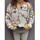 Top pull oversize imprimé visages stylisés
