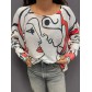 Top pull oversize imprimé visages stylisés
