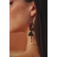 Earrings - Pompoms, thin chains and various beads.