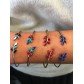 Bracelet - Open thin cuff with enamelled leafs charms.