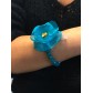 Bracelet - Faceted beads with fabric flower charm and feathers.