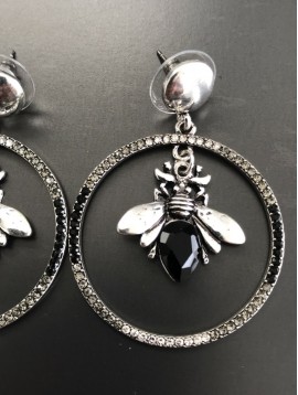 Earrings - Metal circle with hanging bee.