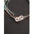 Bracelet - Sliding style multi row with metallic rings charms.