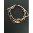 Bracelet - Coulissant multirangs avec anneaux métalliques.