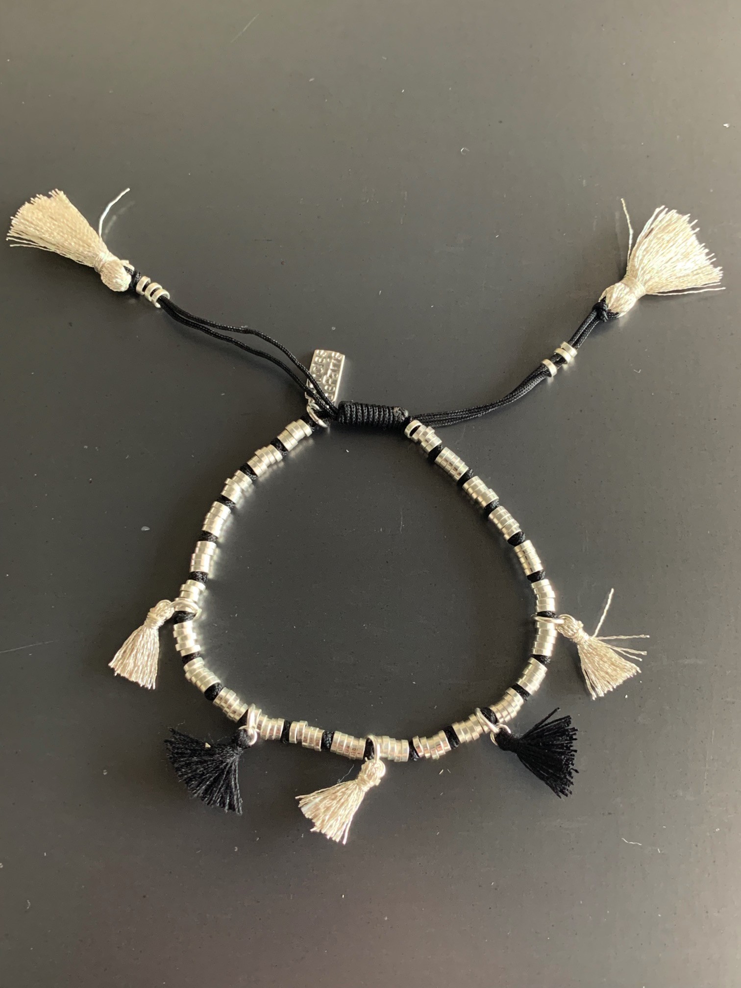 Bracelet Acier - Lien serrage cordon avec rondelles et pompons fils