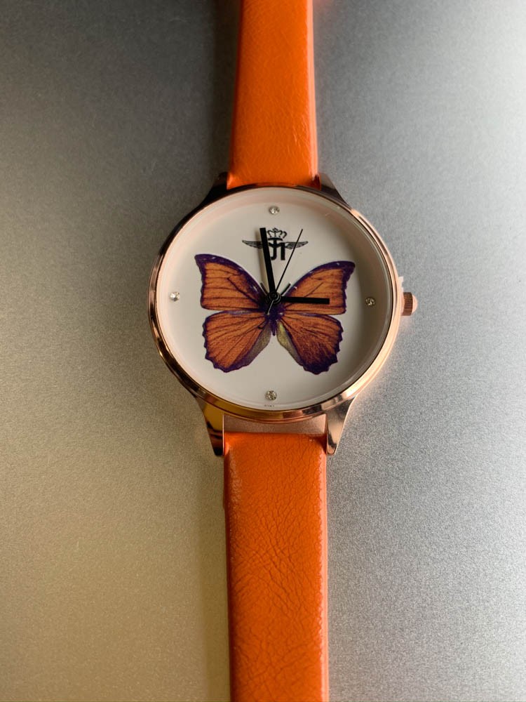 Montre - Bracelet fin papillon au fond du cadran