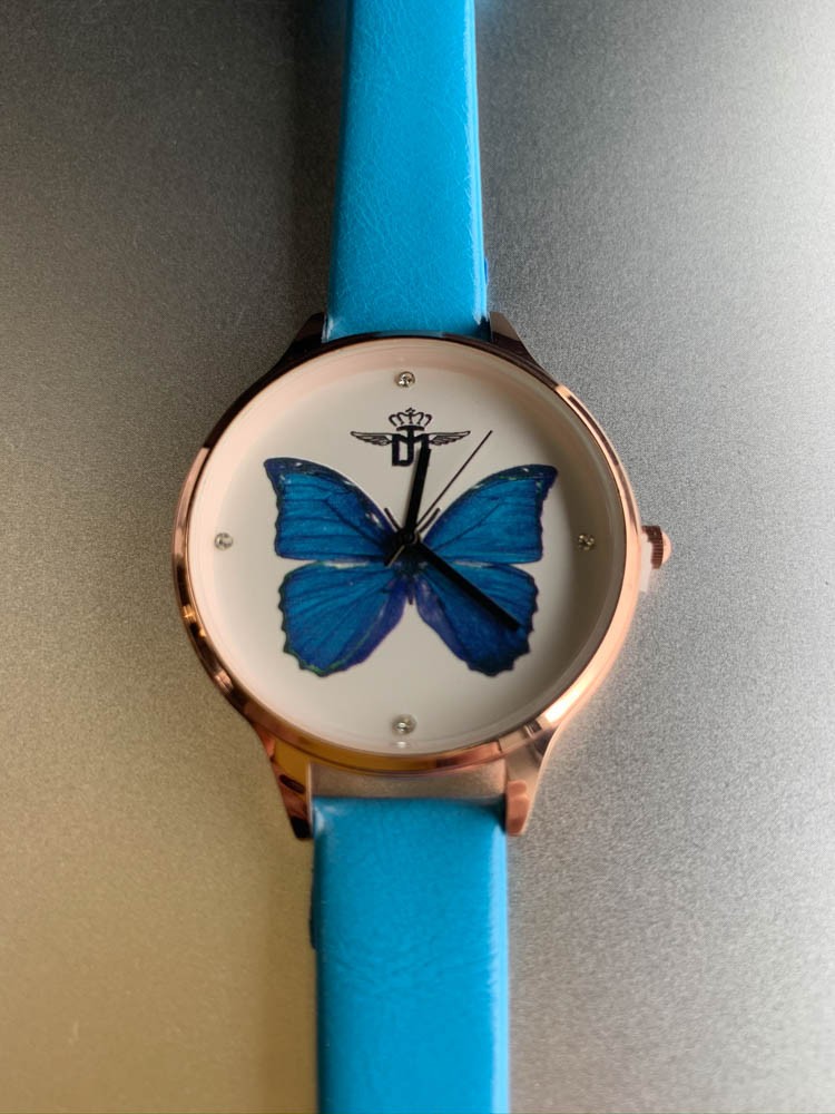 Montre - Bracelet fin papillon au fond du cadran