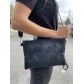 Sac cuir grande pochette porté travers tressage large