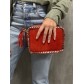 Sac cuir porté travers rectangle avec bords lien doré et pompon