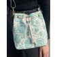 Sac grainage cuir bi matière porté travers style besace effet brodé