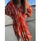 Robe col V crêpe plissé imprimé lozanges manches longues transparentes