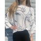 Top pull oversize imprimé visages minimalistes